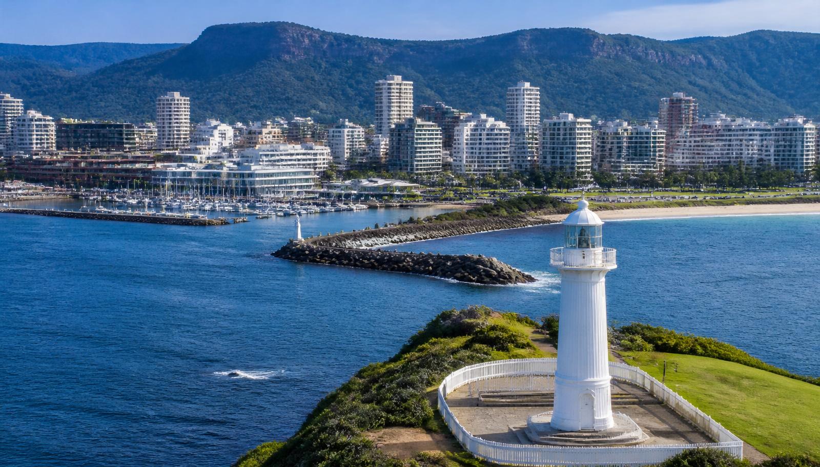 Licensed plumber and electrician servicing Figtree — the Wollongong Head Lighthouse, harbour and Illawarra escarpment, Wollongong NSW.